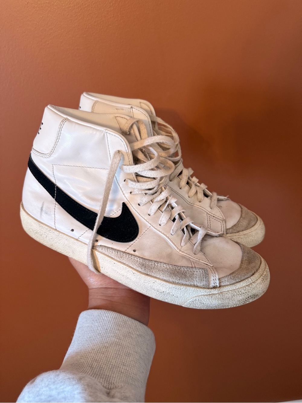 Nike White High-Top Sneakers with Black Swoosh